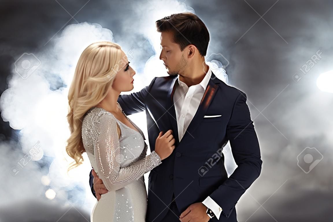 Romantic style portrait of an elegant couple in the night club