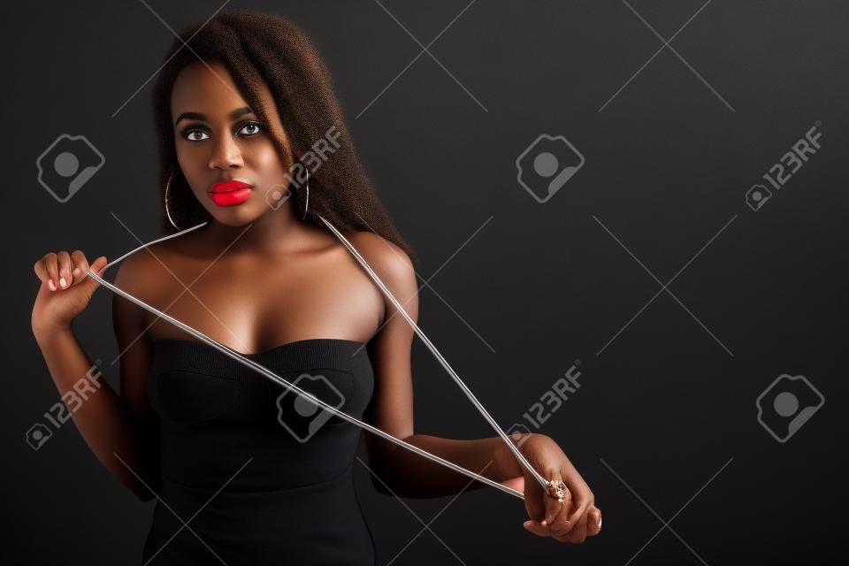 afro-american woman with pearl against black background
