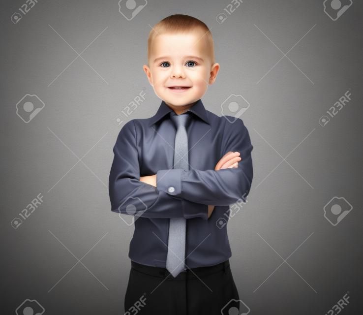 business man with baby face over grey background