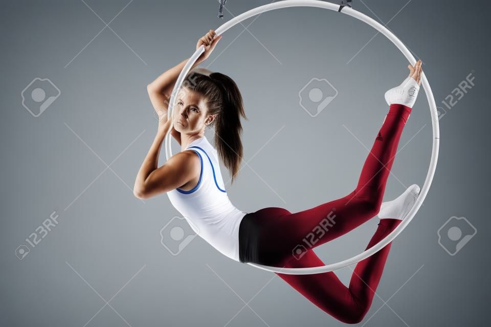 Portrait of an athlete in the air ring isolated on white background
