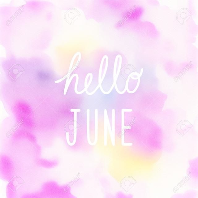 Hello June greeting on abstract pink watercolor background.