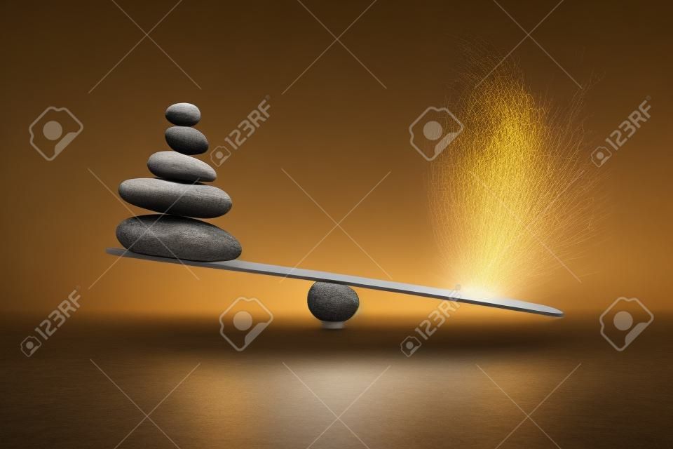 Stenen balans met pluim. Begrip van zwaar en licht.