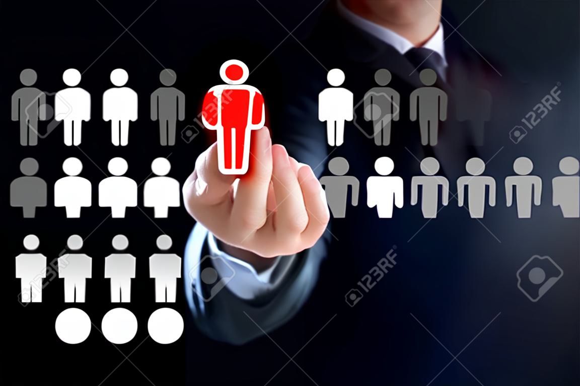 Businessman hand touching red human icon on virtual screen - stand out from the crowd, HR and HRM concepts