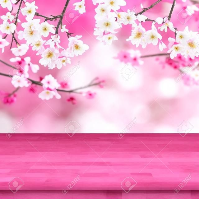 Madera tablero de la mesa en la falta de definición del fondo rosa de Sakura de la flor se puede utilizar para la visualización o sus productos Montage