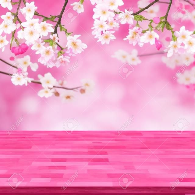 Madera tablero de la mesa en la falta de definición del fondo rosa de Sakura de la flor se puede utilizar para la visualización o sus productos Montage
