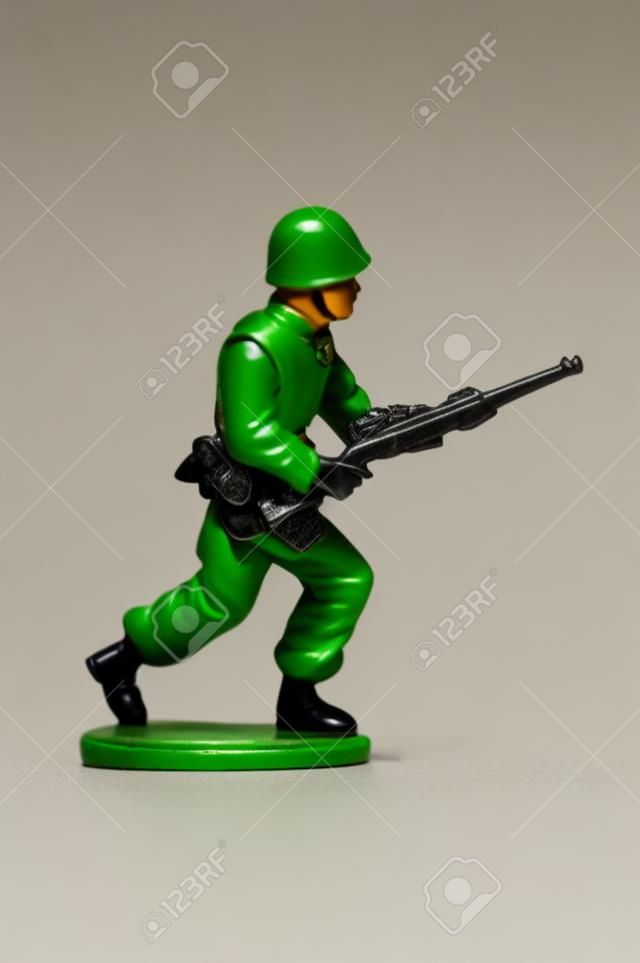 miniture toy soldier on white background, close-up 