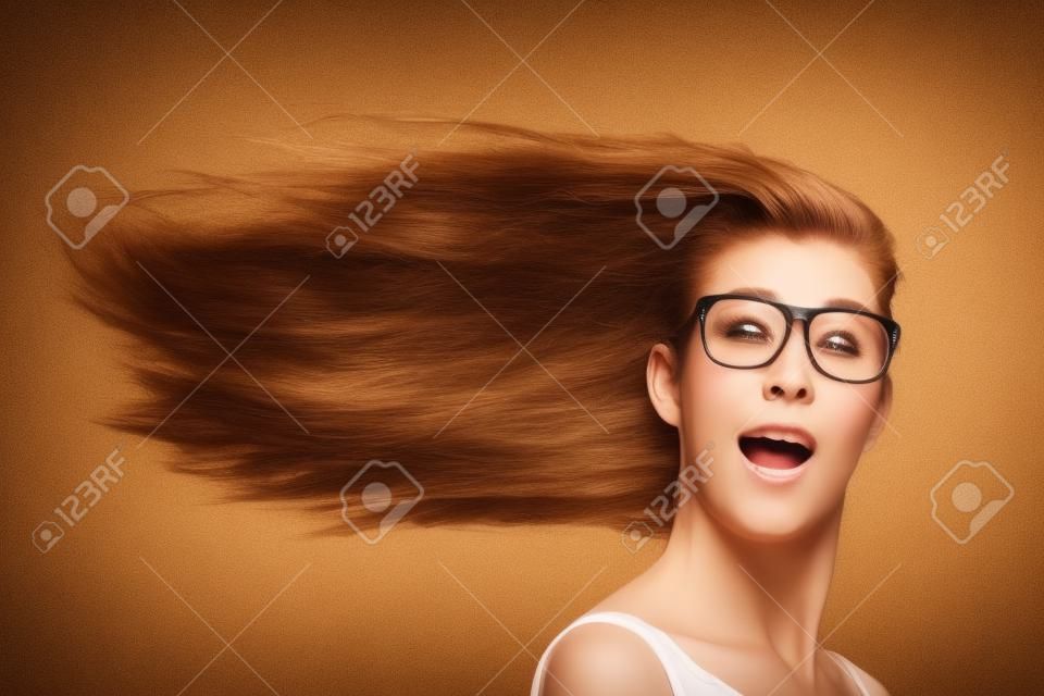Long hair of woman blowing in head wind