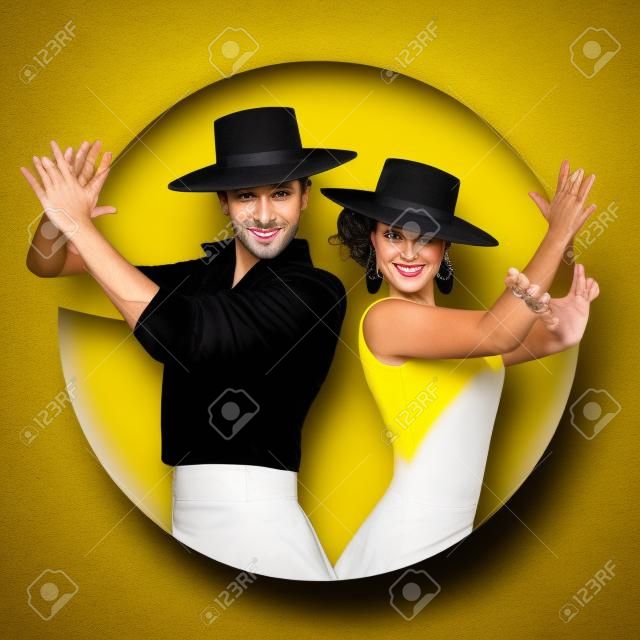 Couple of Spanish flamenco dancers wearing typical hats, playing clapping. Yellow circle on white background