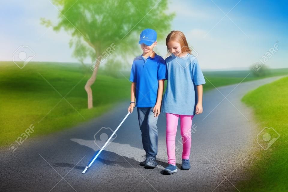 Teenager girl helping to blind brother by walking each other at mountain - concept of caregiver,friendship bonding and disability.