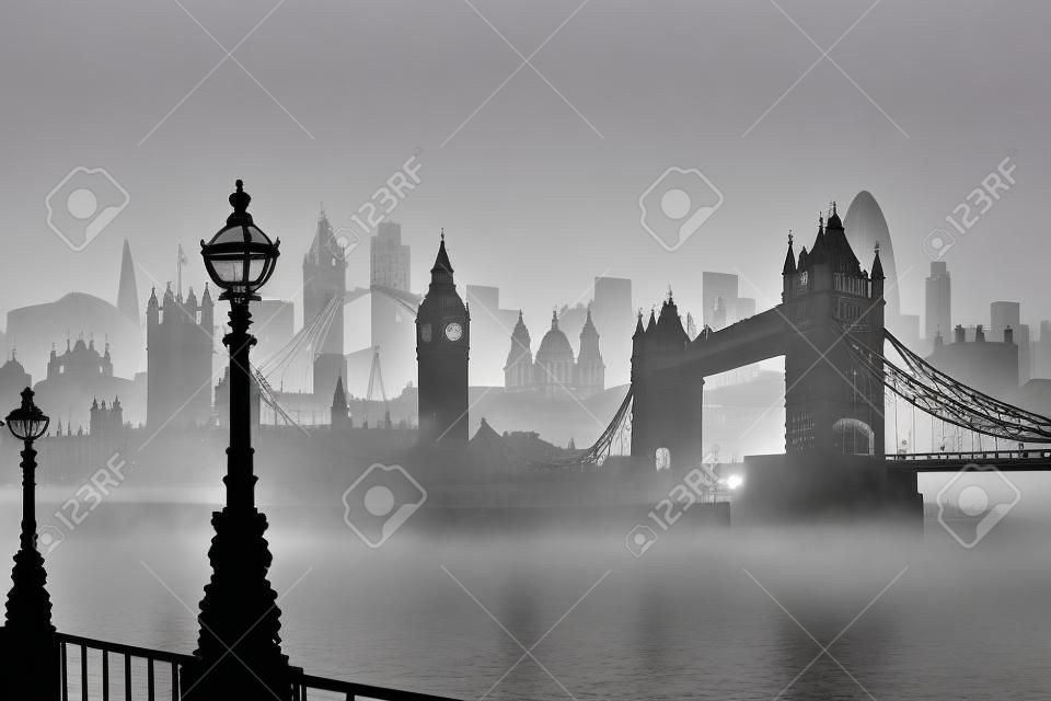 Silhouettes of London sights in the fog over the river Three lines of silhouettes