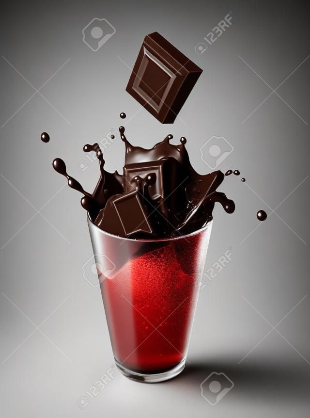 Chocolate blocks falling into a glass full of liquid chocolate, splashing. On white background.