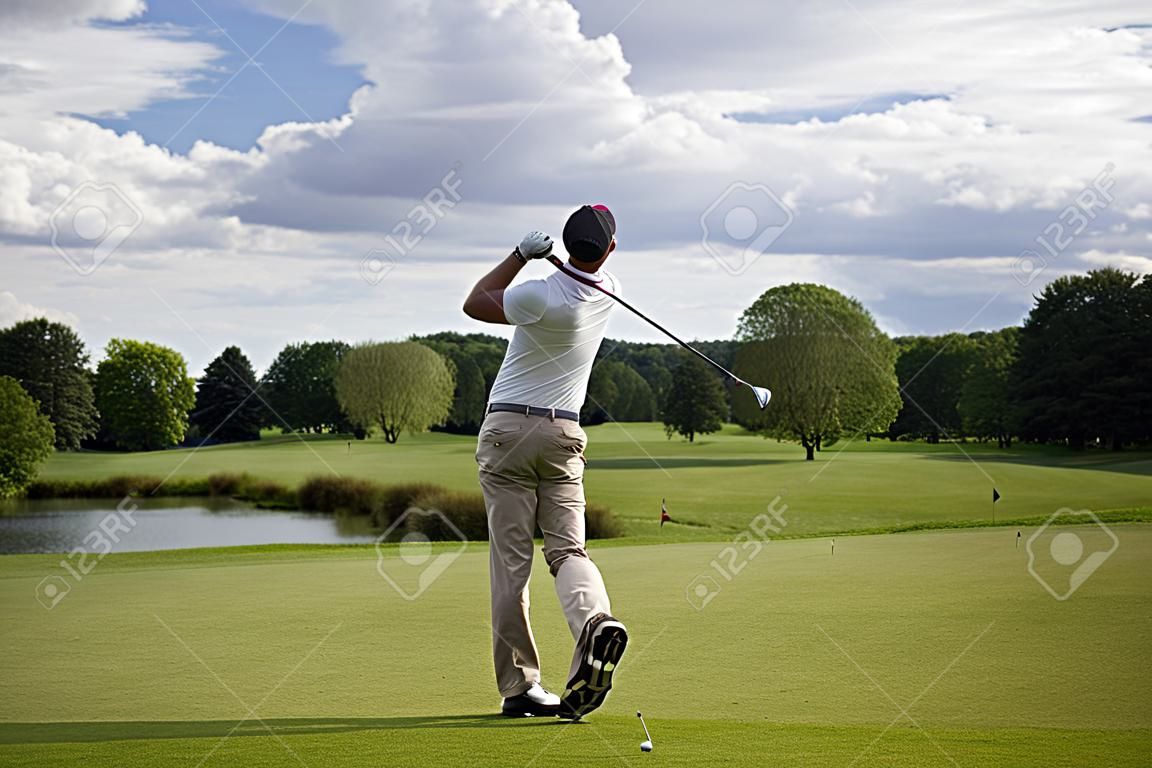 Golf player teeing off