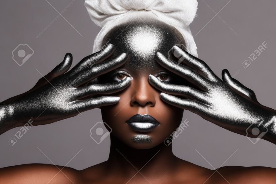 african american girl with silver makeup