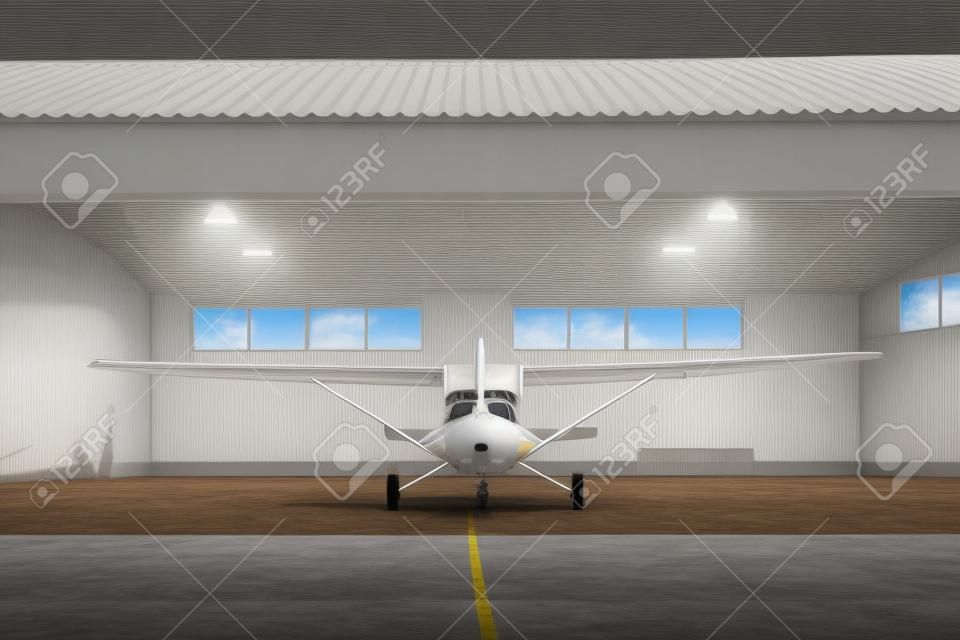 格納庫に立つ小さな近代的な白い飛行機