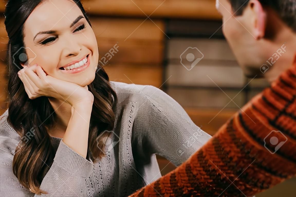 selective focus of smiling woman looking at man