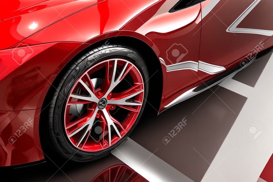 shiny new red automobile with metallic wheel in car showroom