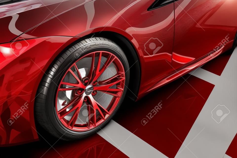 자동차 쇼룸에 금속 바퀴가 달린 빛나는 새 빨간 자동차