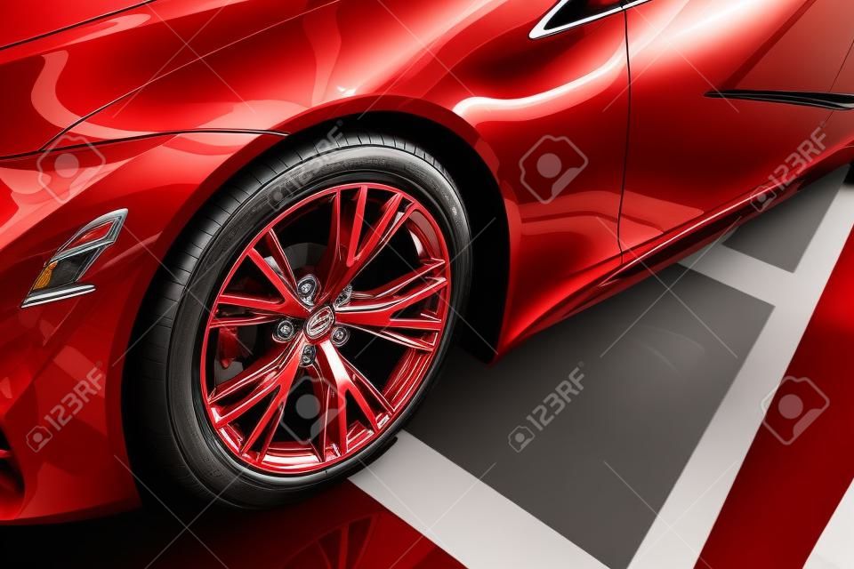 nuova automobile rossa lucida con ruota metallica nell'autosalone