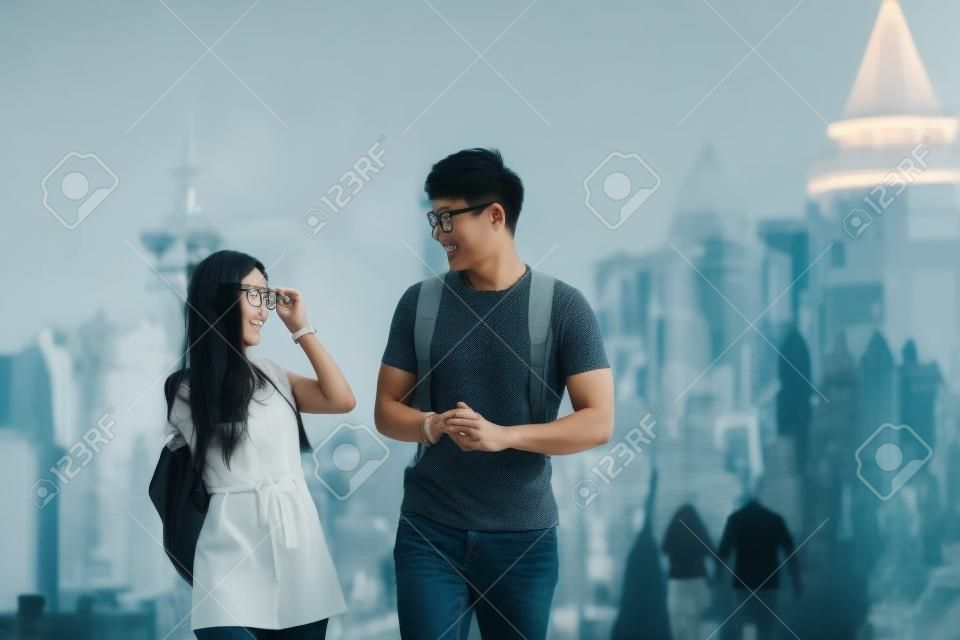 handsome man and asian woman with glasses looking at each other