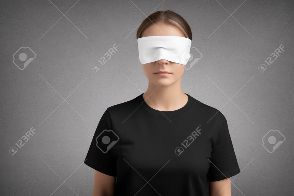 blindfolded young woman in black t-shirt isolated on white, human rights concept