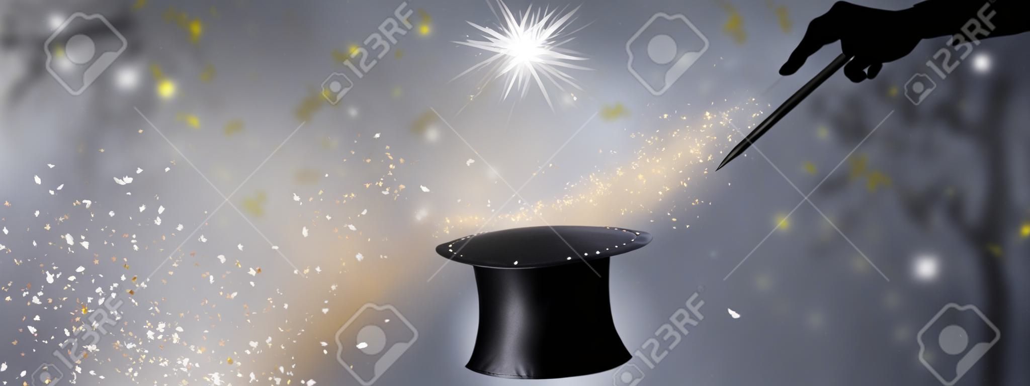 magician hands with black hat and wand