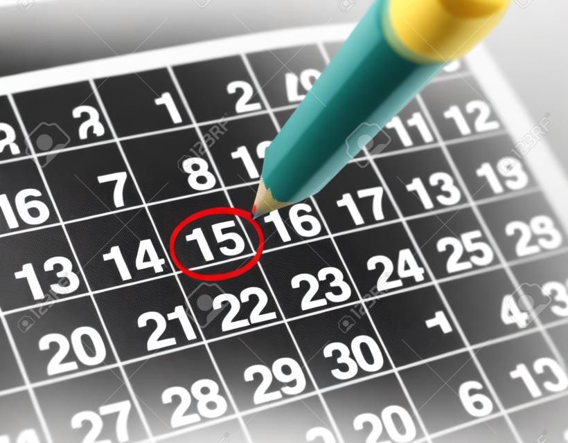Establecer una fecha importante en un calendario con un lápiz rojo marcado un día del mes que representa la organización de tiempo y programación.