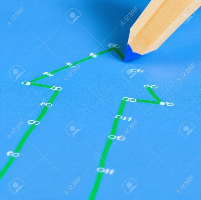 Success strategy and step by step business planning as a blue pencil drawing connection lines to connect the dots on a puzzle shaped as an arrow going up as a financial metaphor for a successful planned personal project 