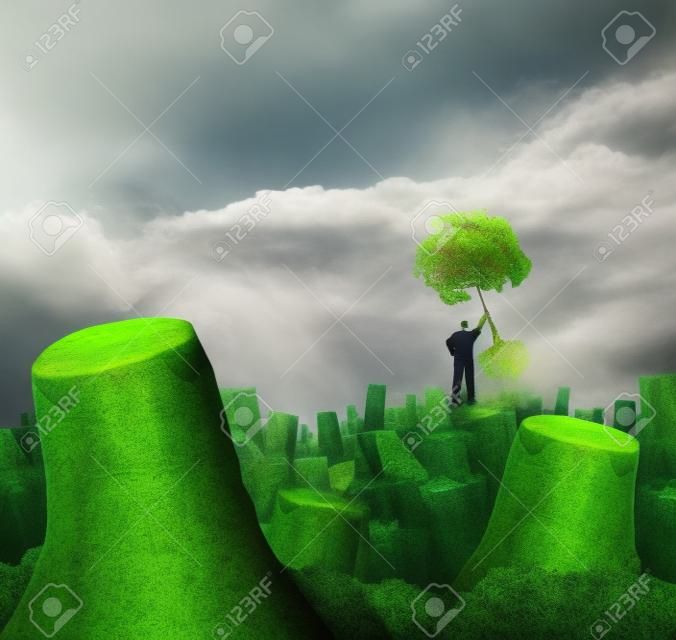 Disaster plan concept als een persoon staan op een heuvel in een dood bos met gesneden bomen houden een gezonde jonge groene sapping als symbool van vertrouwen in economisch herstel en geloof in visie voor toekomstige groei succes.