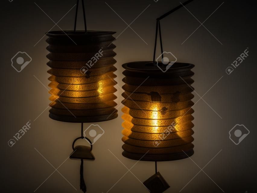 2 lanterns with dark background