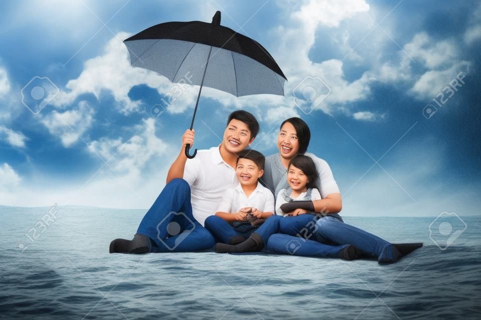 man holding umbrella for his family