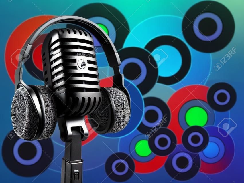 Microphone with headphones on background
