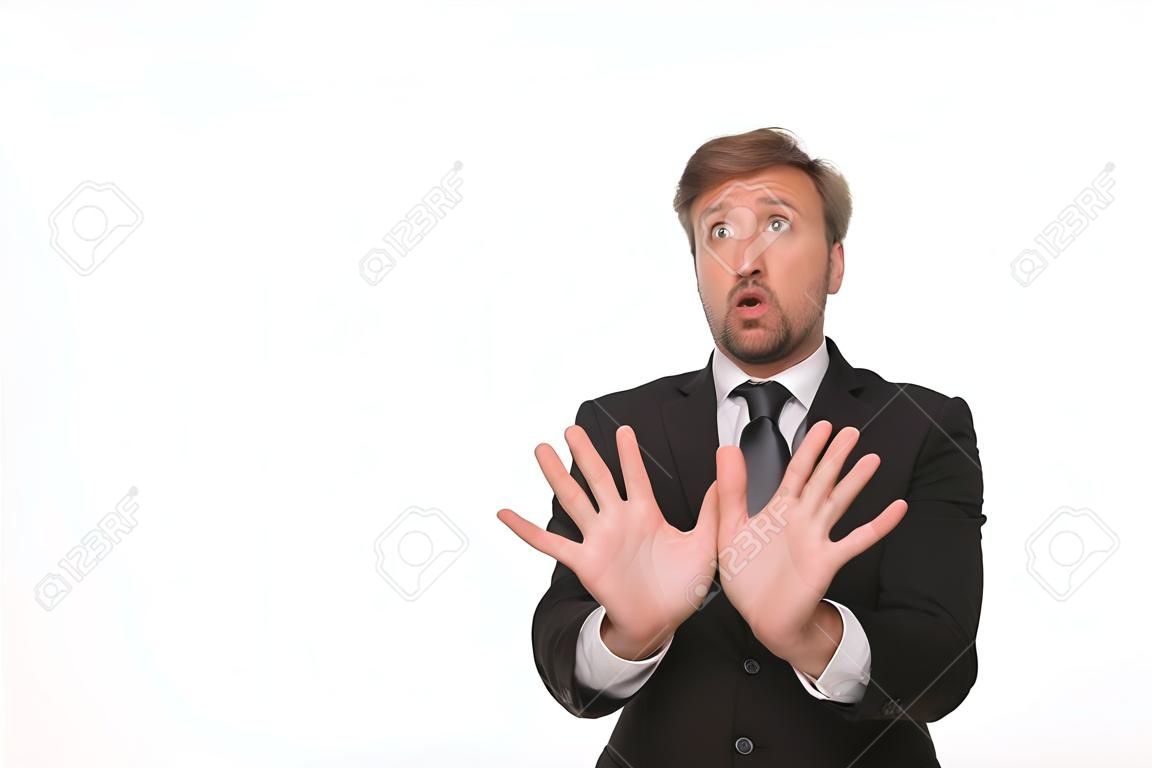 Picture of frightened businessman isolated on white background. Man in business suit showing fear with his hands.