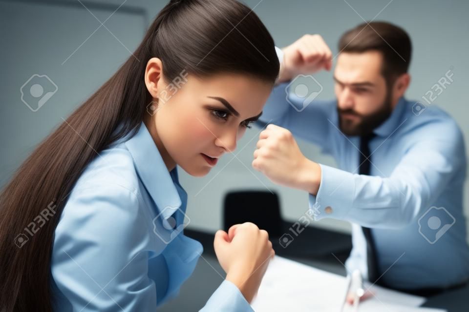 Agressive colleagues dispute while working. Compete in business. Fight of genders concept.