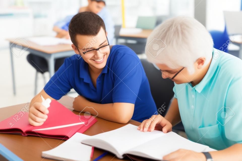 Adult education students studying together in class.  