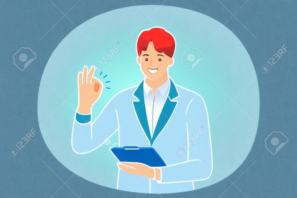 Positive emotions, ok sign and gesture language concept. Young positive businessman cartoon character standing with tablet or documents in hand and showing agree okay success sign with fingers