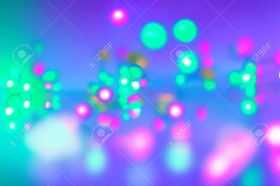 some pearls with colored lights on a mirror