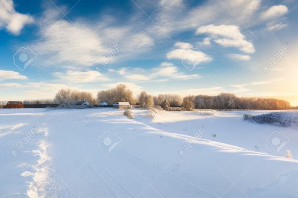 Winter landscape. Countryside. Snowy road. Sunny day. Blue sky White clouds Horizontal