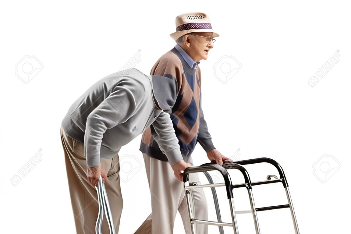 Elderly men walking with crutches and a walker isolated on white background