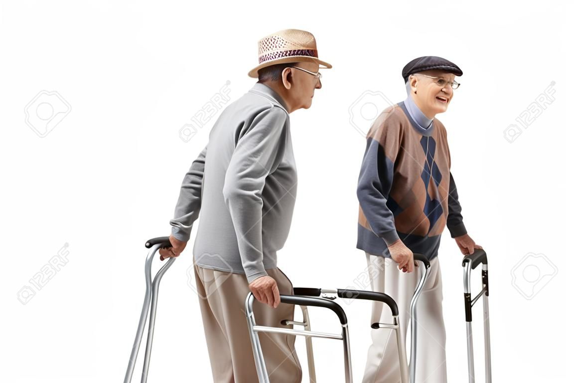 Elderly men walking with crutches and a walker isolated on white background