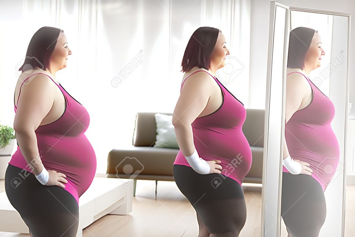 Plus size woman in sportswear looking at her reflection in a mirror at home