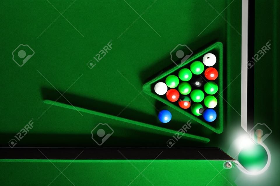 Billiard table with green surface and balls in the billiard club.Pool Game.