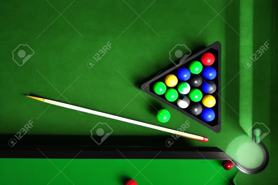 Billiard table with green surface and balls in the billiard club.Pool Game.