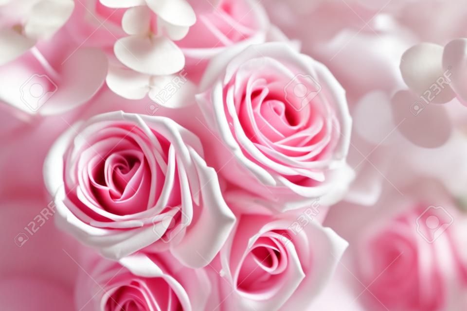 Elegant bouquet of pink and white roses on a dark background, soft focus, close-up. Romantic hipster background. Vintage filter.