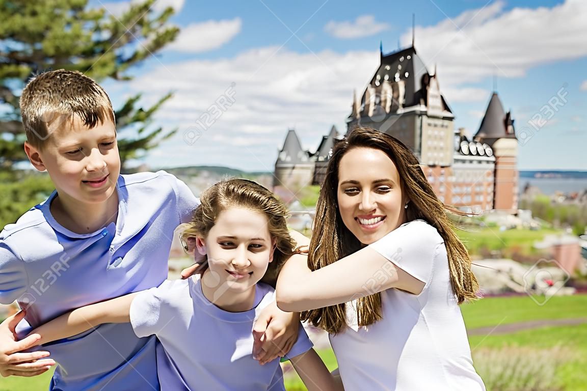 family in summer season in front of Chateau frontenac Quebec
