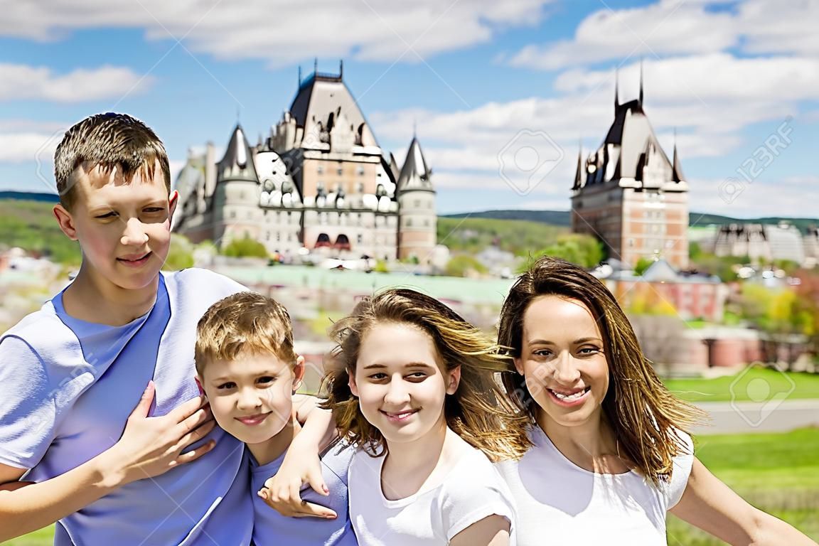 family in summer season in front of Chateau frontenac Quebec