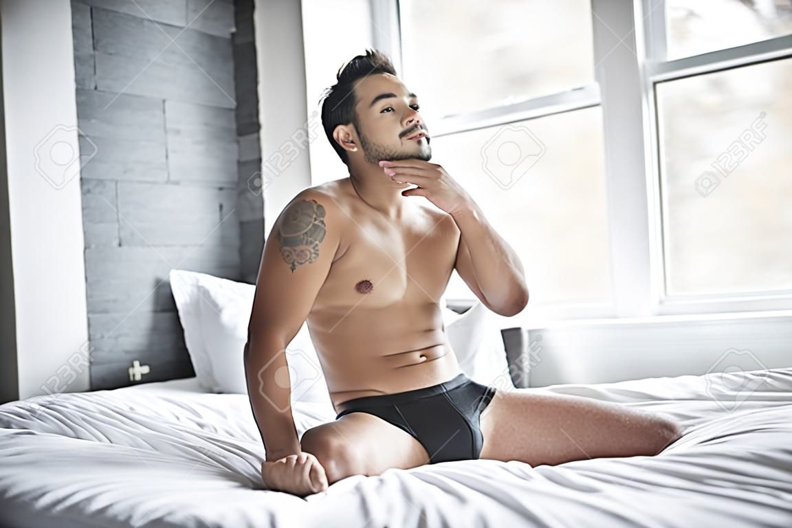 A Young Mexican Man Shirtless In White Bed Stock Photo, Picture and Royalty  Free Image. Image 112727687.