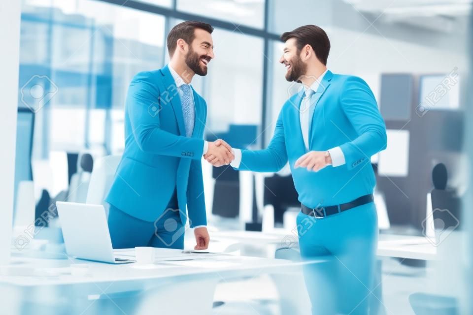 businessman successfully completed business meeting with smiling clients