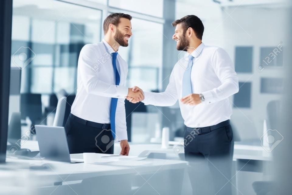 businessman successfully completed business meeting with smiling clients