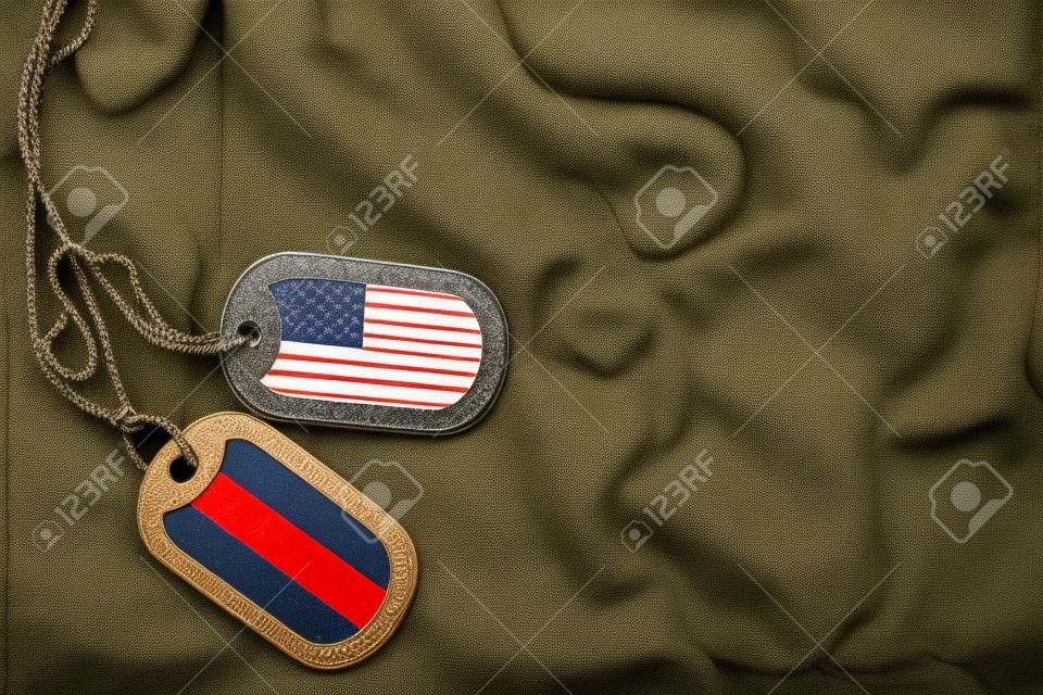 army blank, dog tag with flag of united states of america and yemen on the khaki texture background. military concept