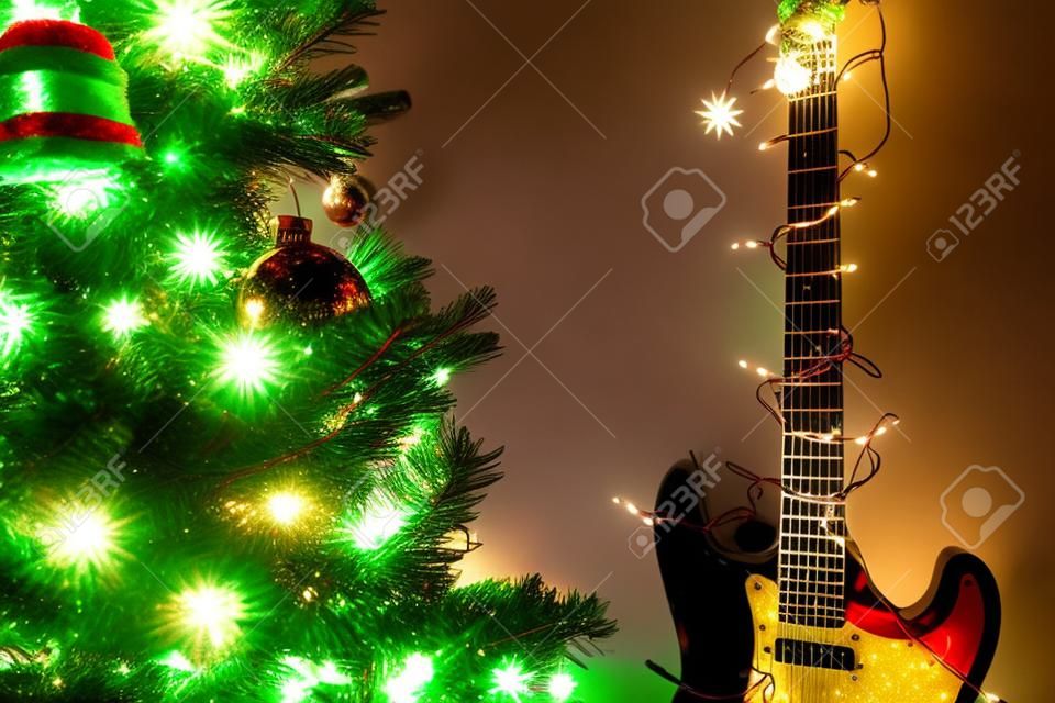 Seasonal holiday musical instrument electric guitar wrapped in Christmas tree string lights